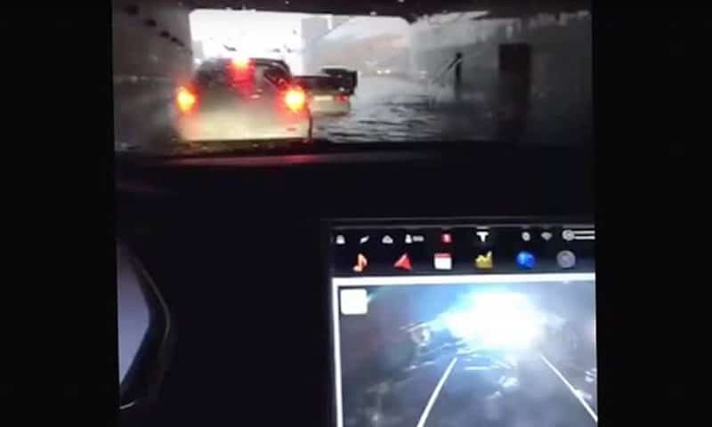 The Tesla Model S floats through a flood like a boat in the video, below